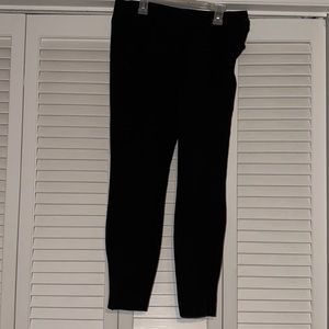 chico’s black tapered trousers with side-zippers on pant legs